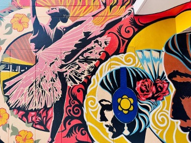Detail of mural showing dancer dressed in pink