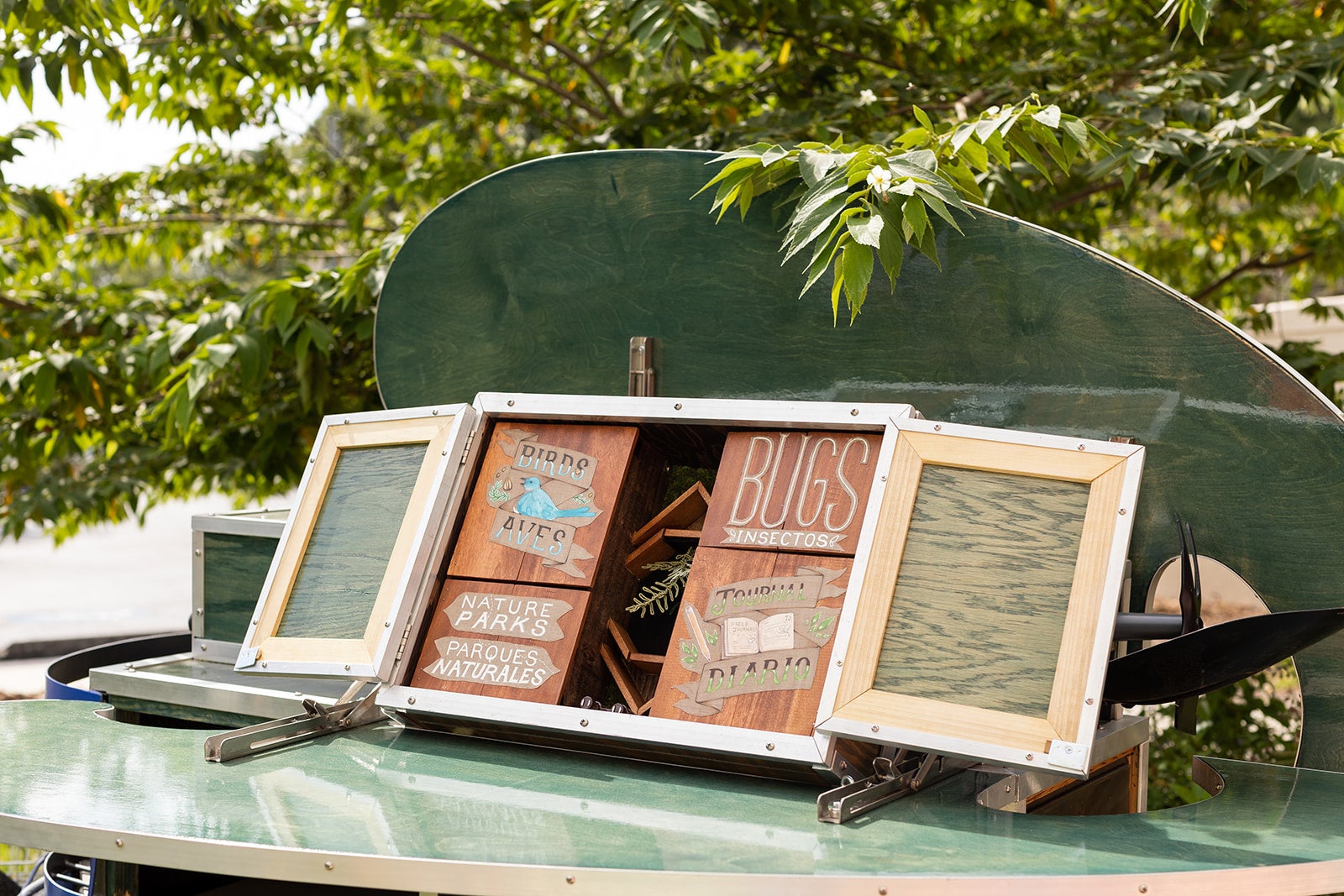 Open wooden box frame mounted on top of cart