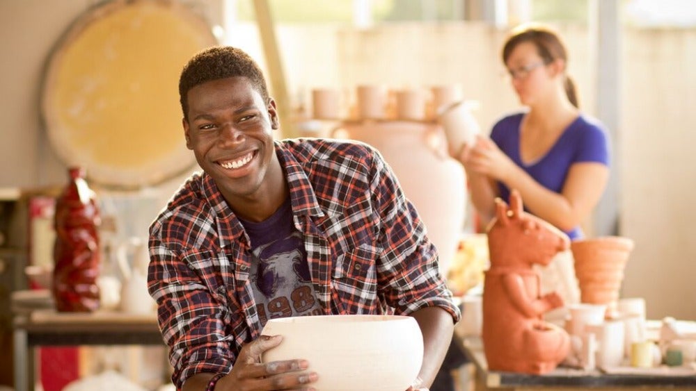 Student making a sculpture