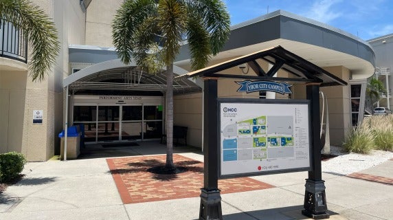Entrance to Ybor City Campus with Performing Arts building and campus map directory.