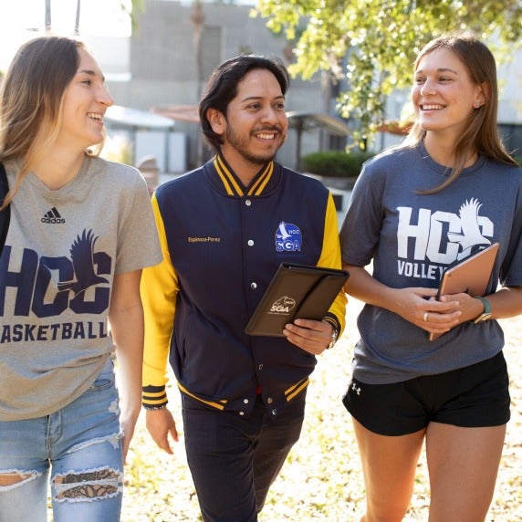 Three students walking together