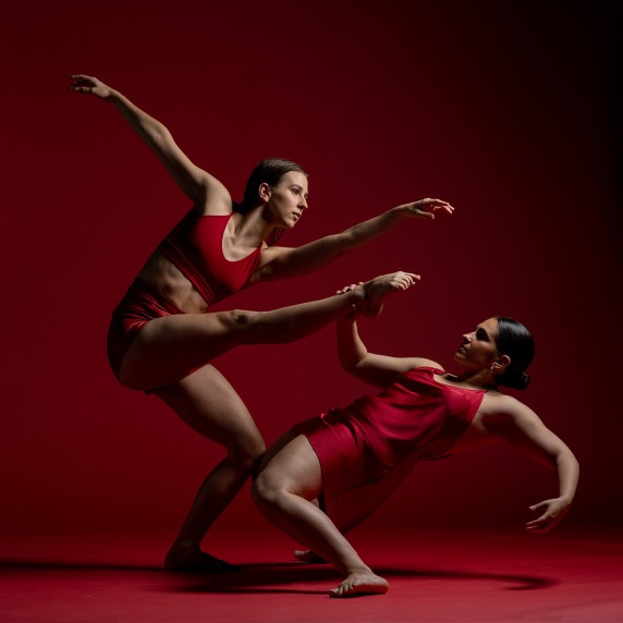 Two dancers in sepia and red