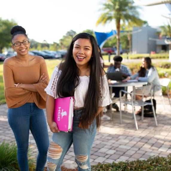 Two students standing