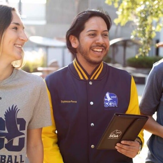 Man in letter jacket smiling