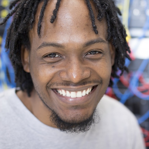 African American male engineering student smiling at camera