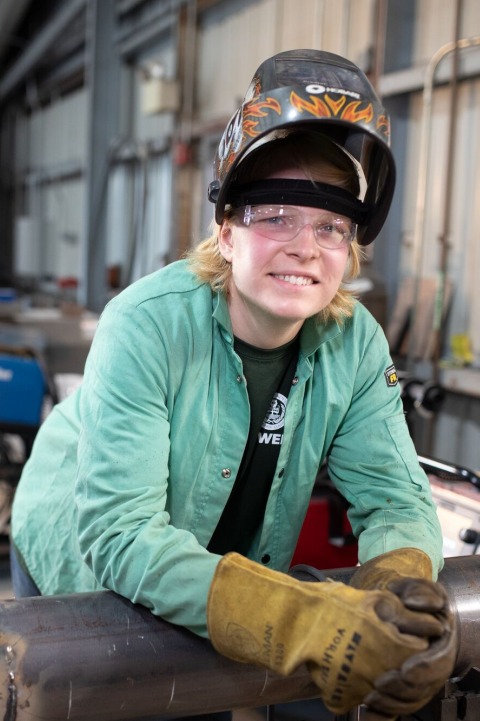 Welding student with leather gloves