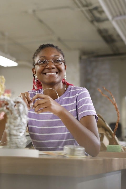 Student working on sculpture