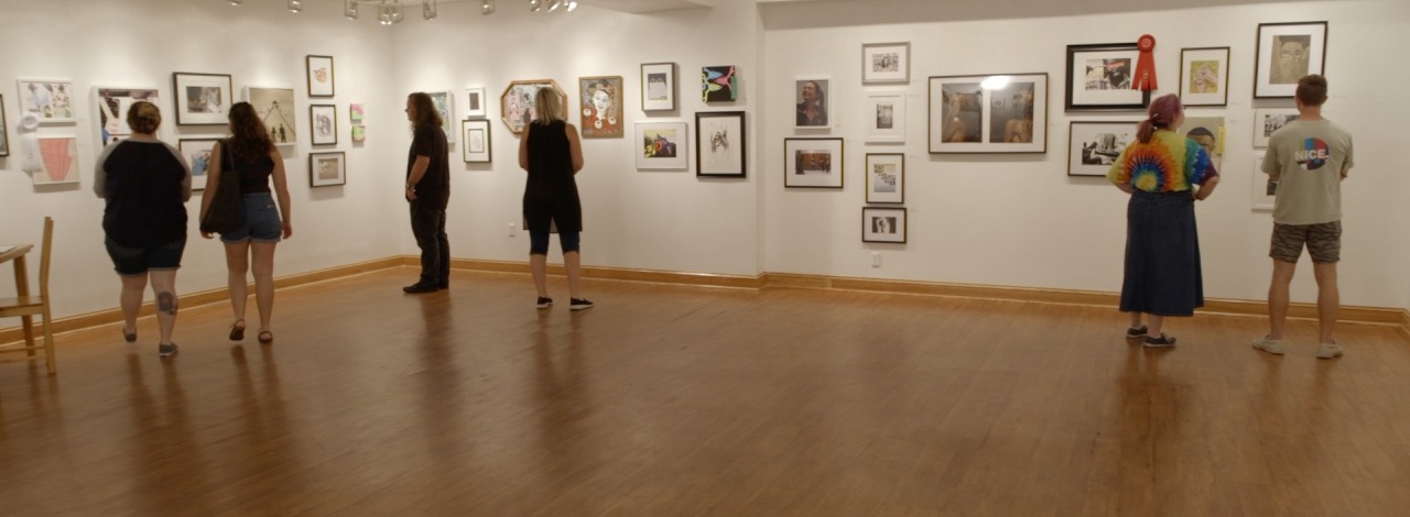 Group of people enjoying an art gallery