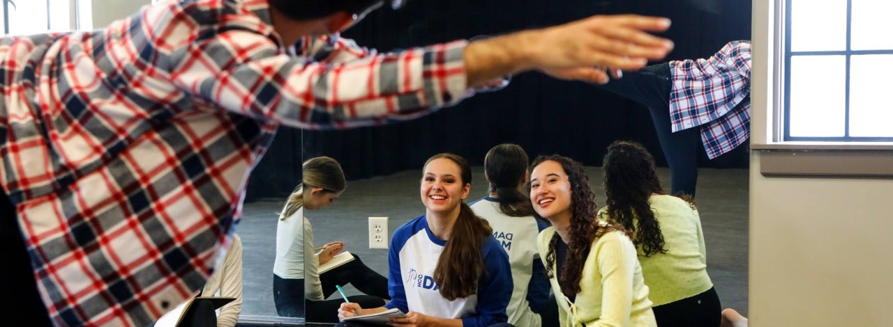 Dancer leaning to the right with arm extended