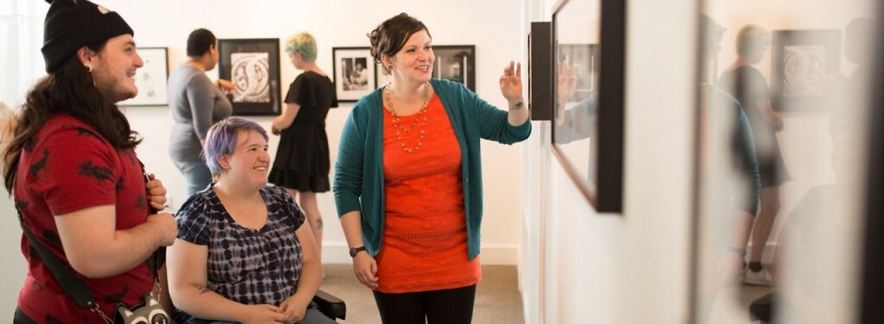 Students looking at art in an art gallery. 