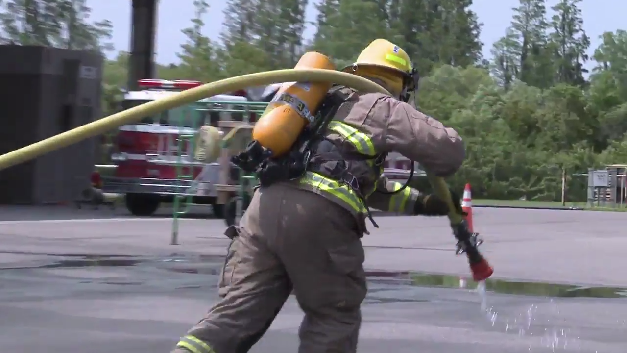 Fireman pulling hose