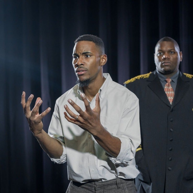 Actor reaches out with expressive hands