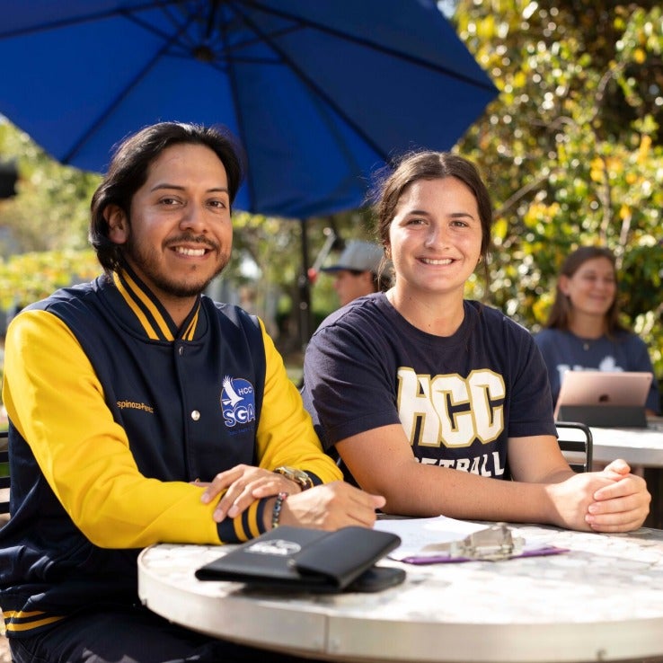 Two students sitting in the NEST site on the Dale Mabry Campus.
